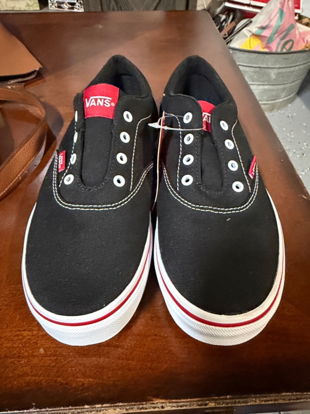 Vans Black Canvas Slip-On Sneakers with Red Trim